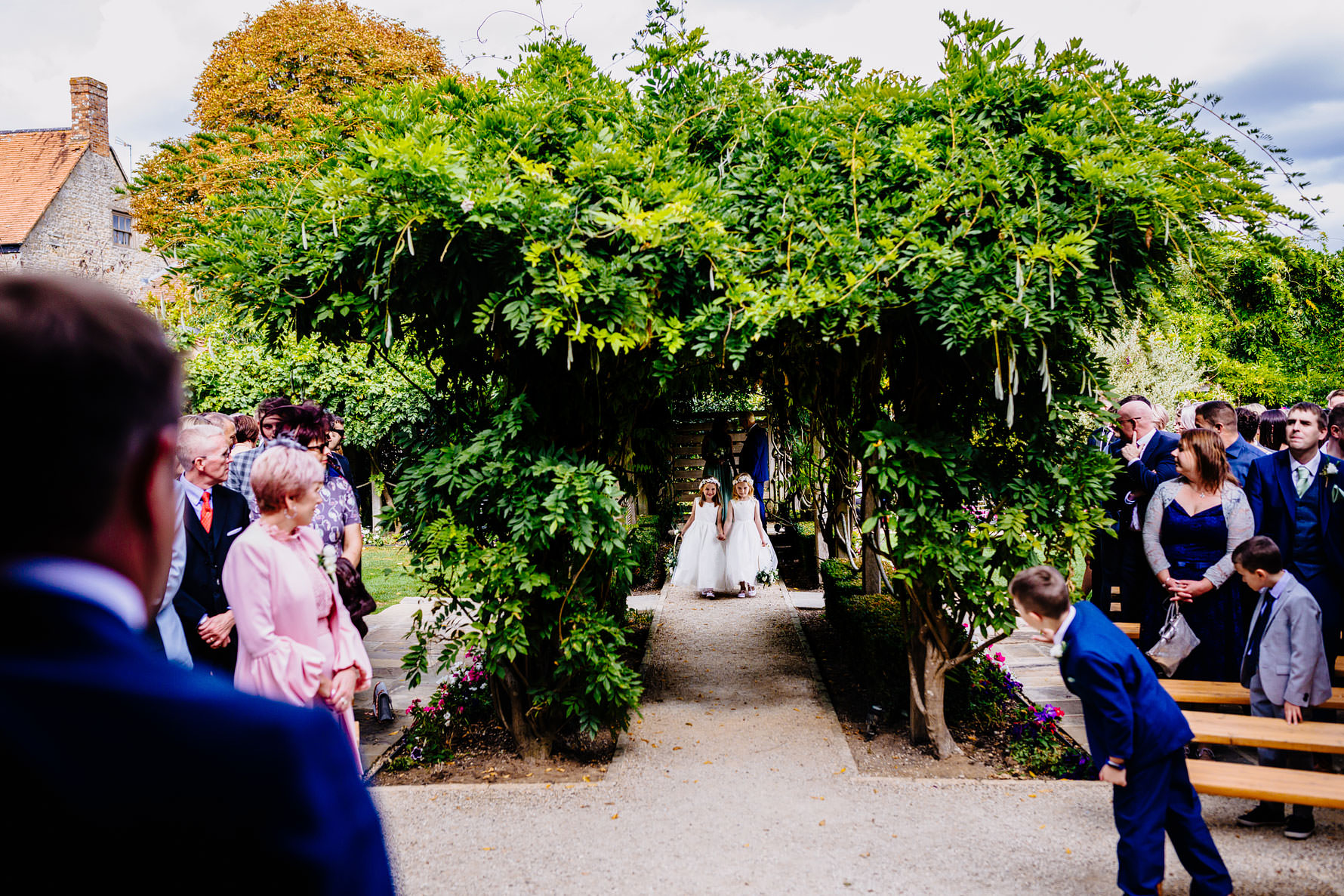 flower girls walking down the aisle