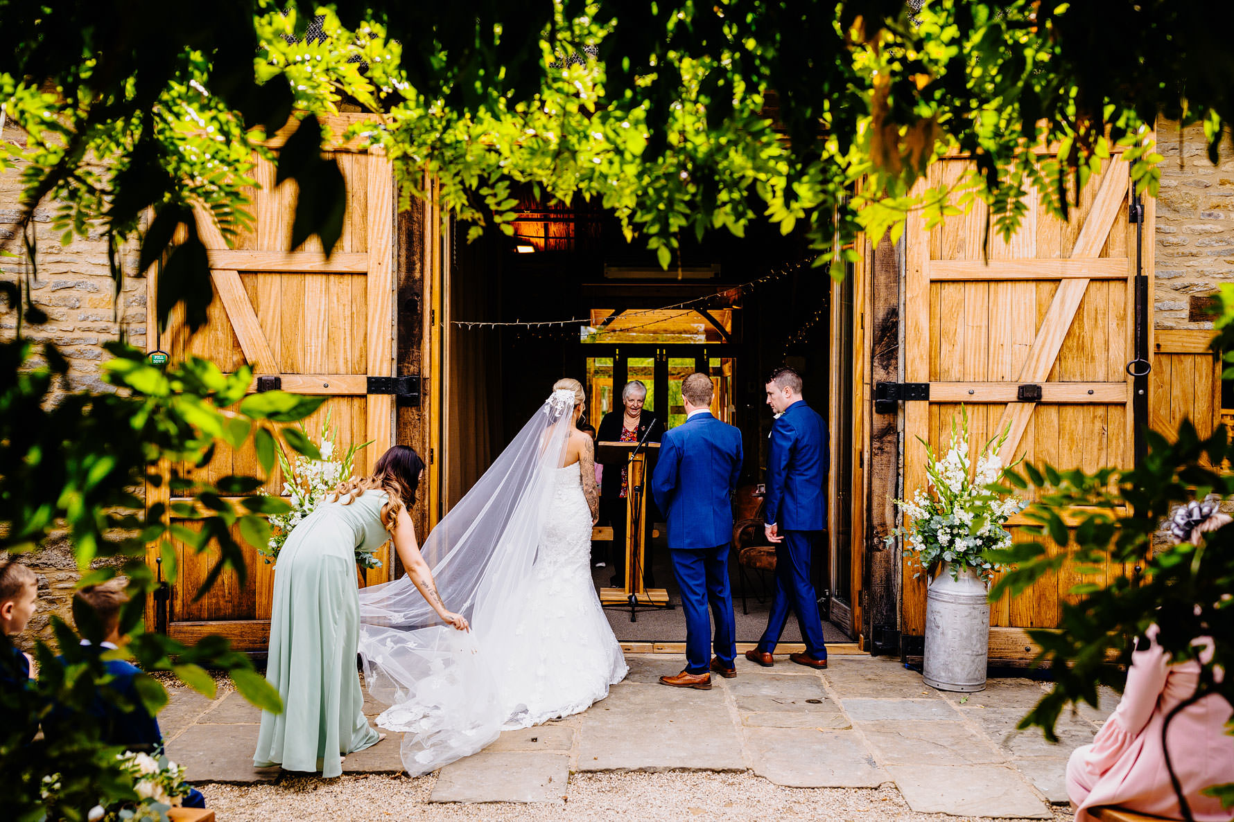 a bridesmaid perfects the veil