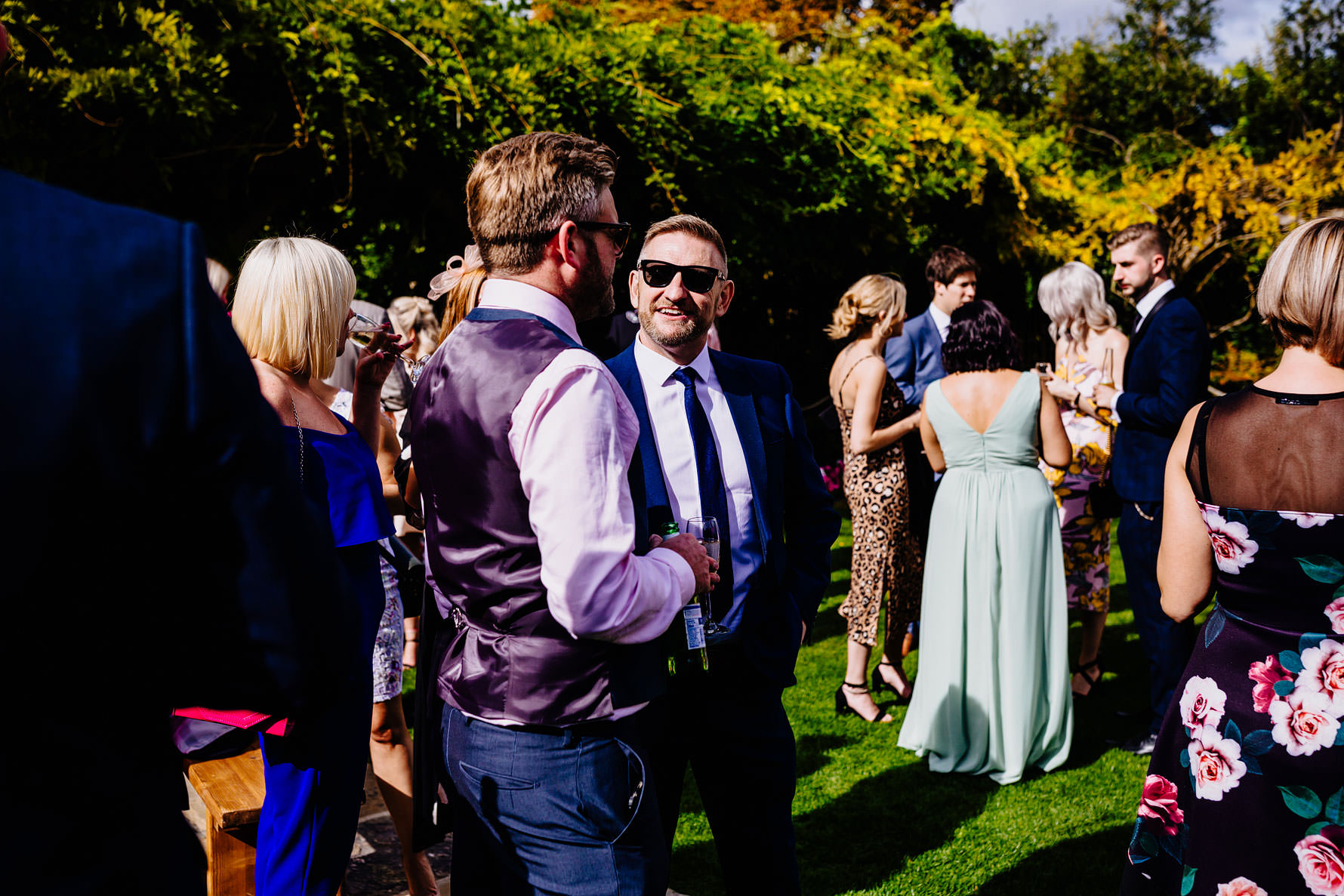 a smiling man in sunglasses