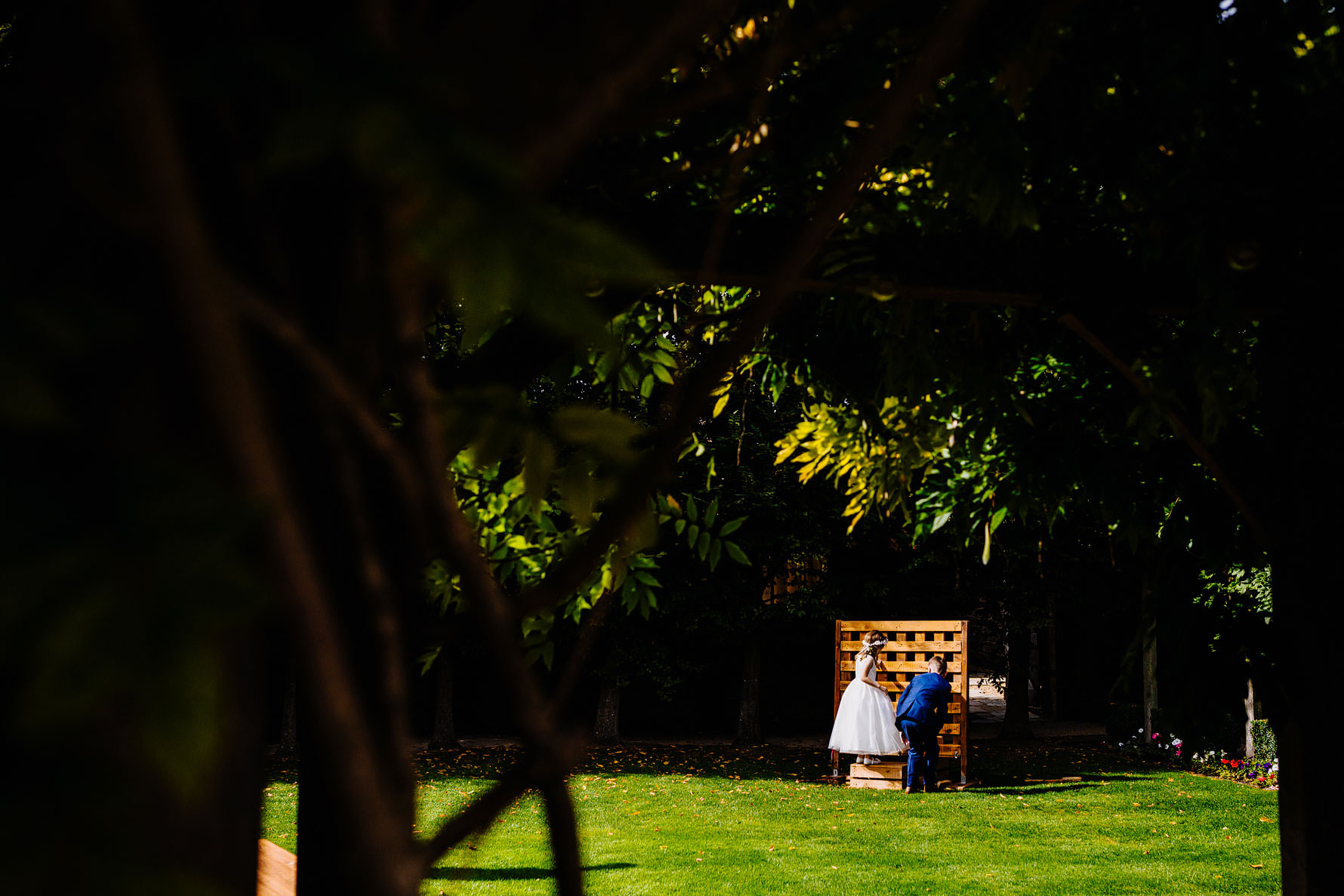 a Page boy and flower girl enjoying garden games