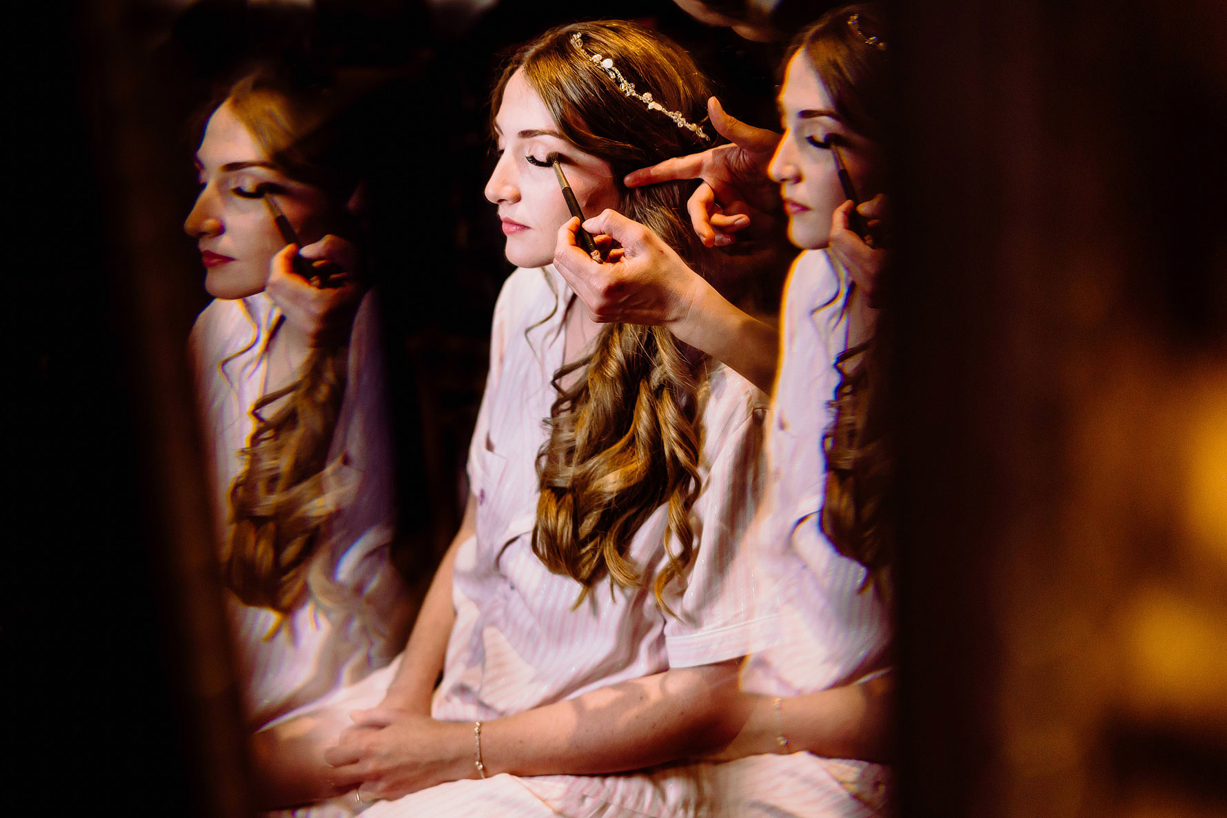 make up being applied to a bride