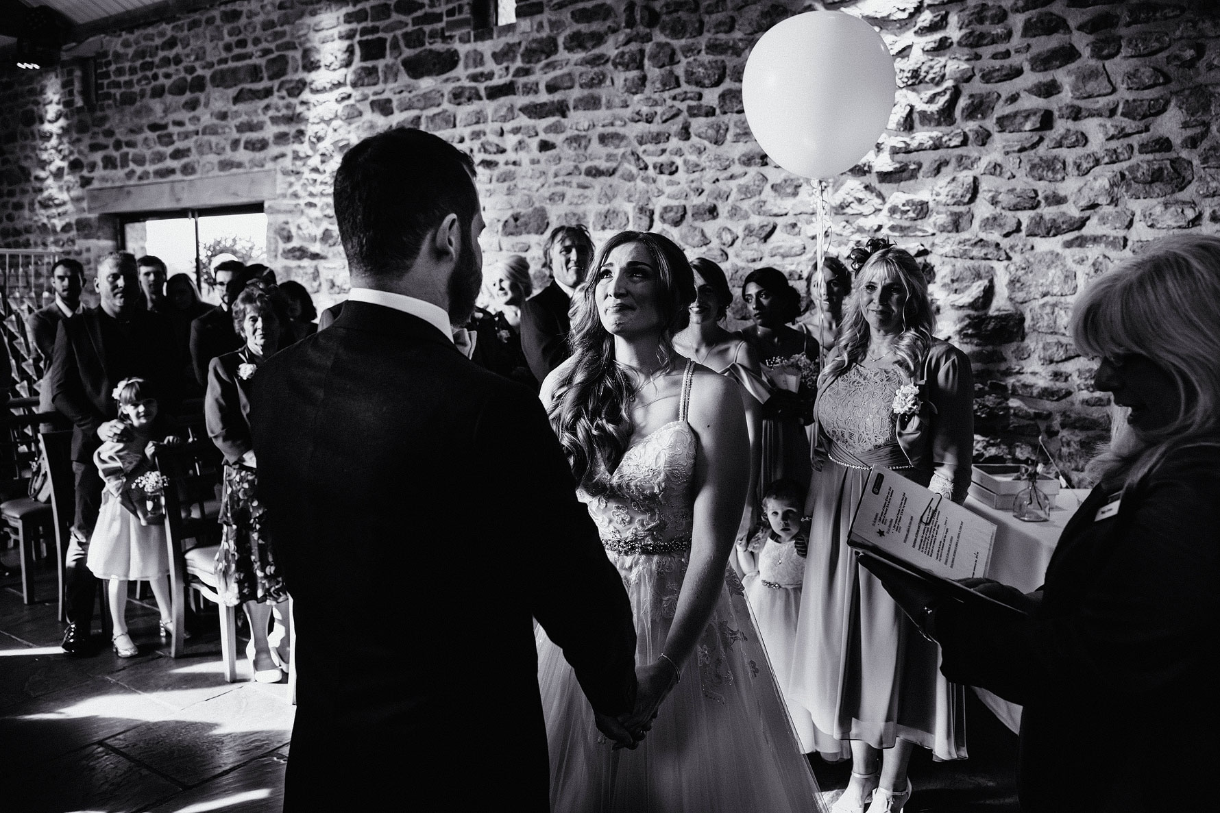 an emotional bride during her Dodford manor wedding ceremony