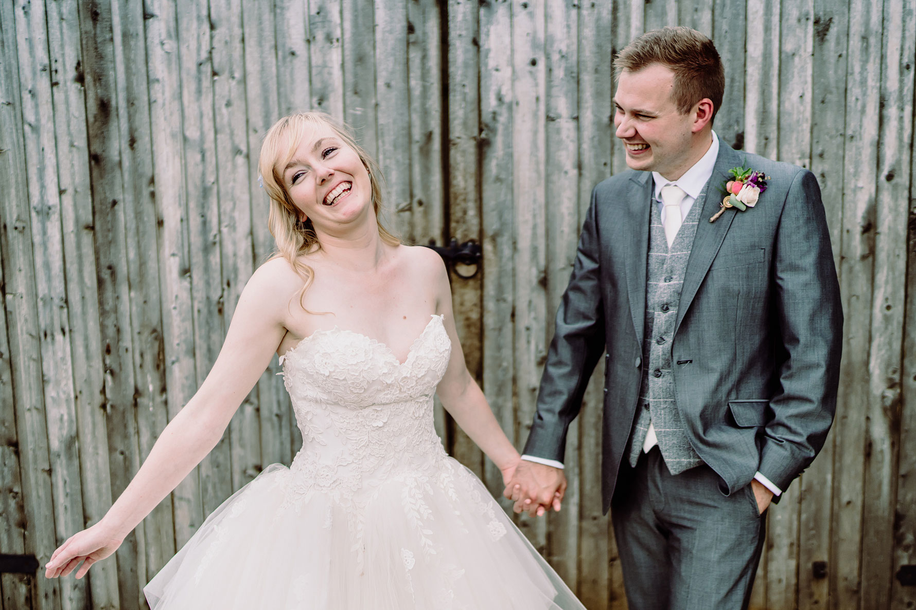 A happy couple share a moment during their wedding at dodford manor