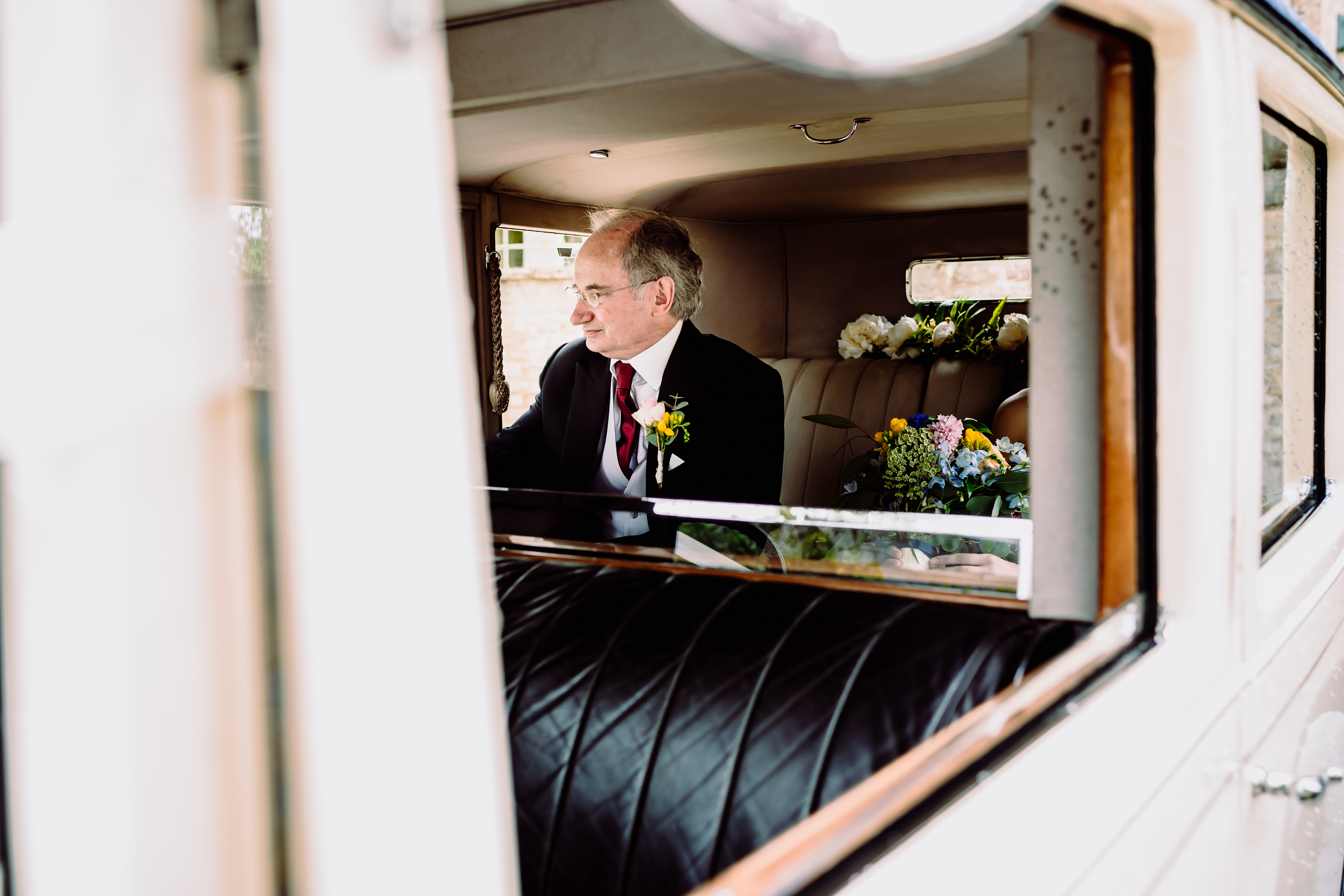 the father of the bride looks nervous before the walk down the aisle