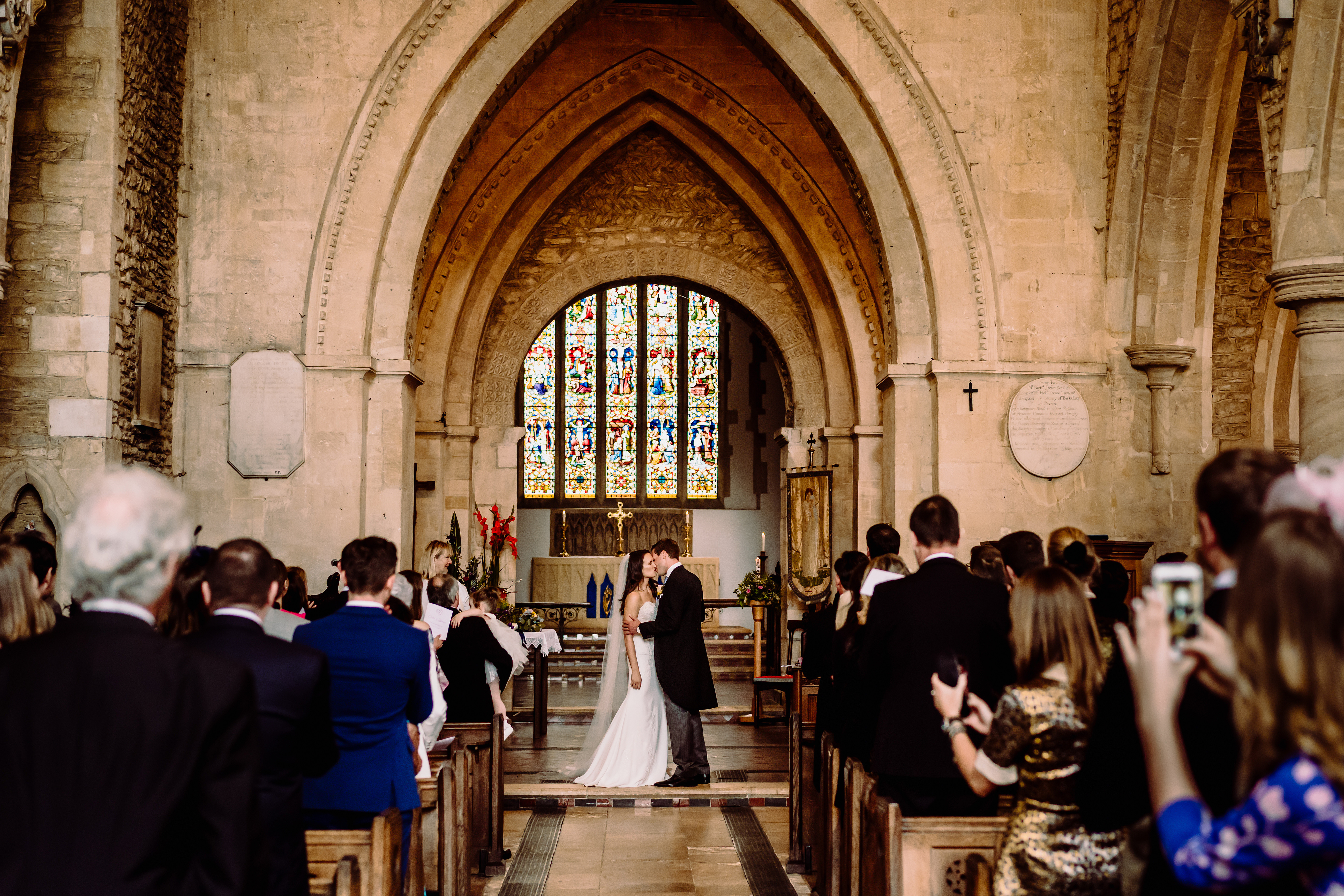 a kiss for the bride and groom