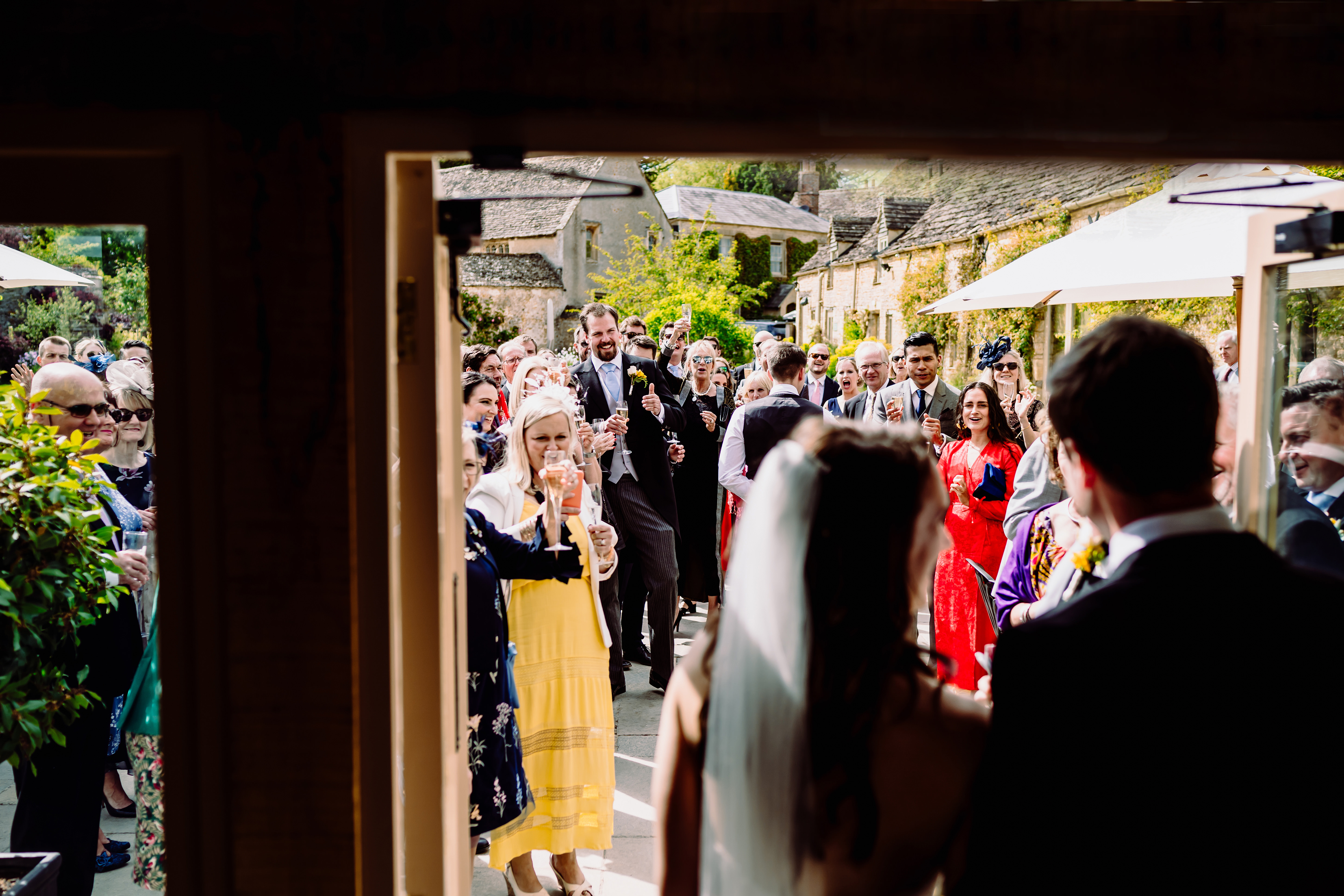 happy wedding guests greet the bride