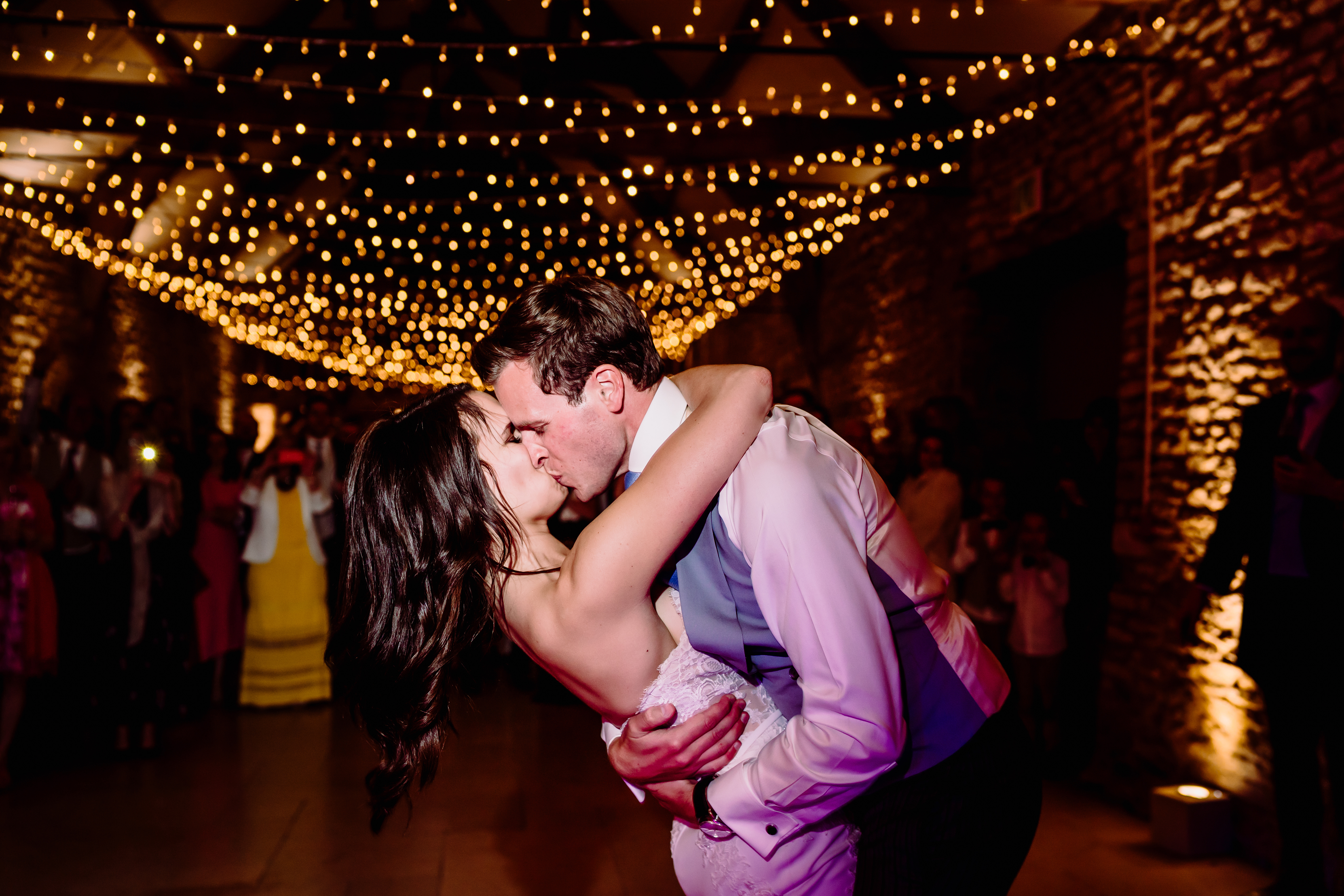 a bride and groom kiss