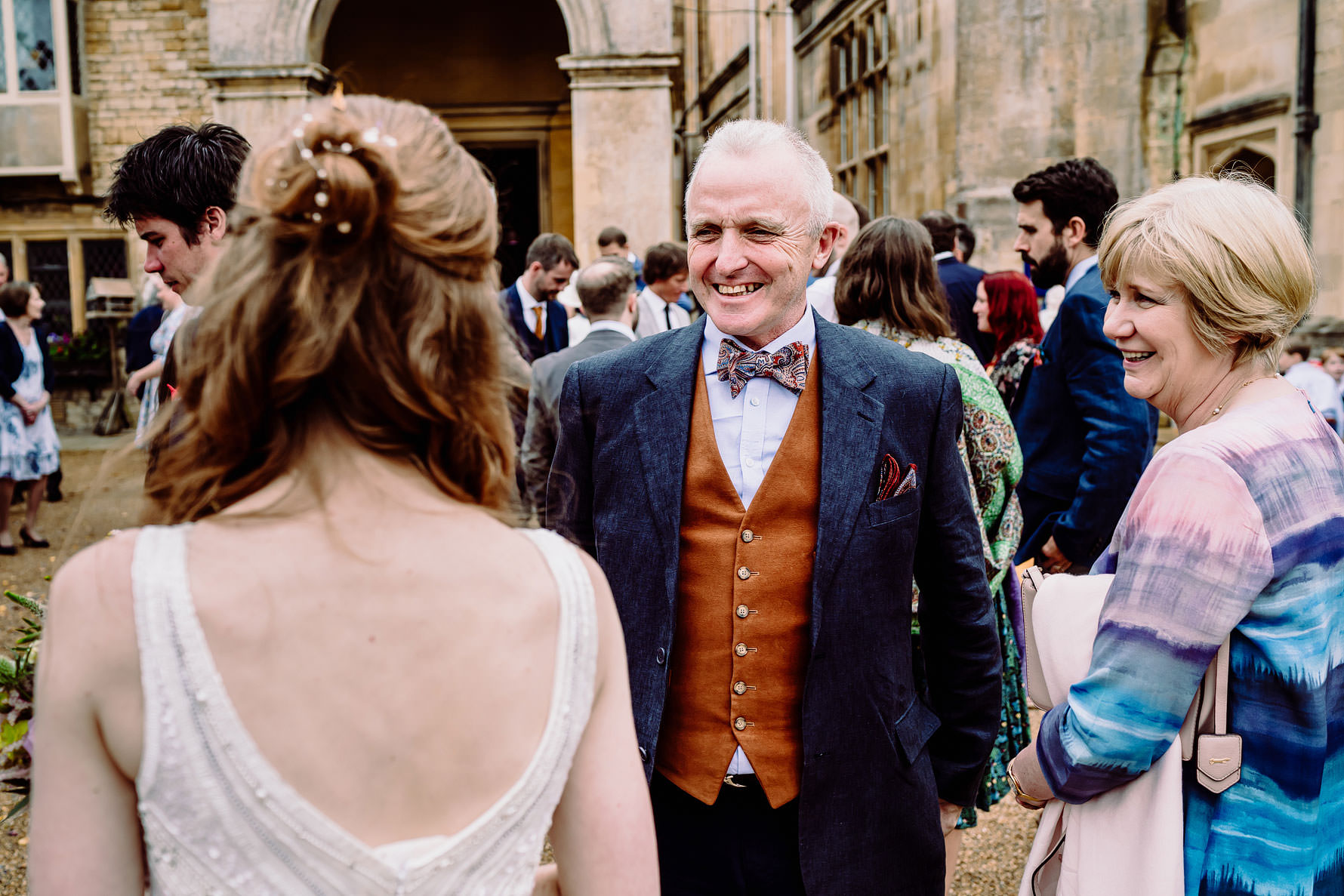 a guest congratulates the bride at her wedding