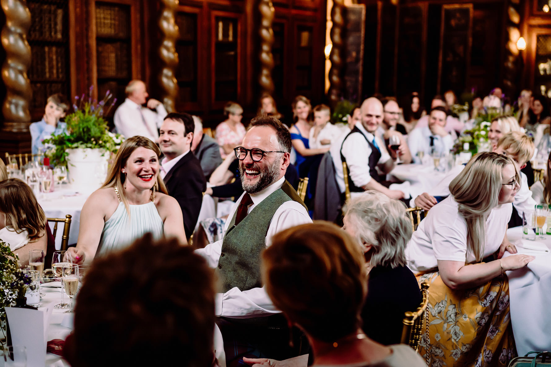 a guest laughing at a speech