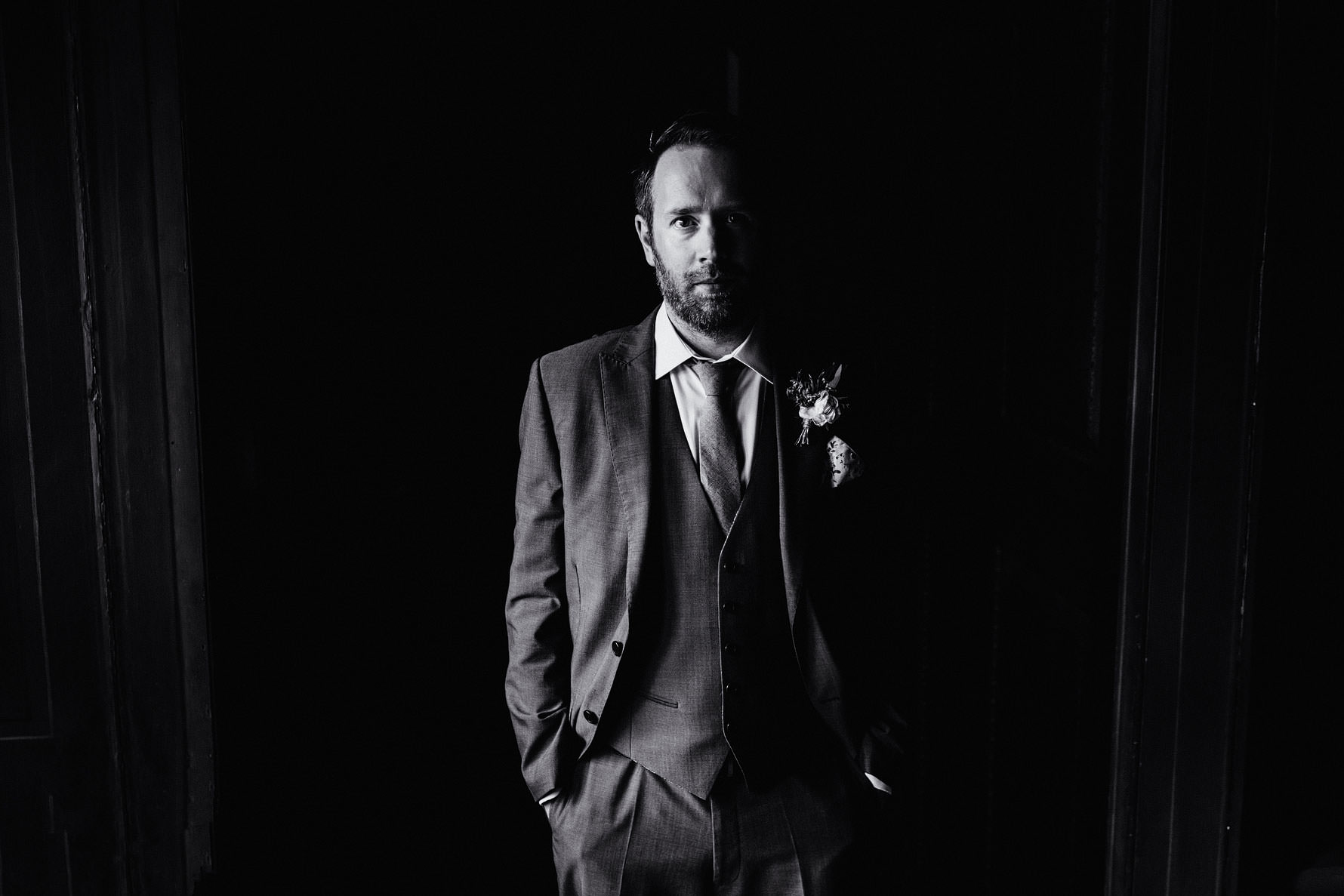 a black and white groom portrait