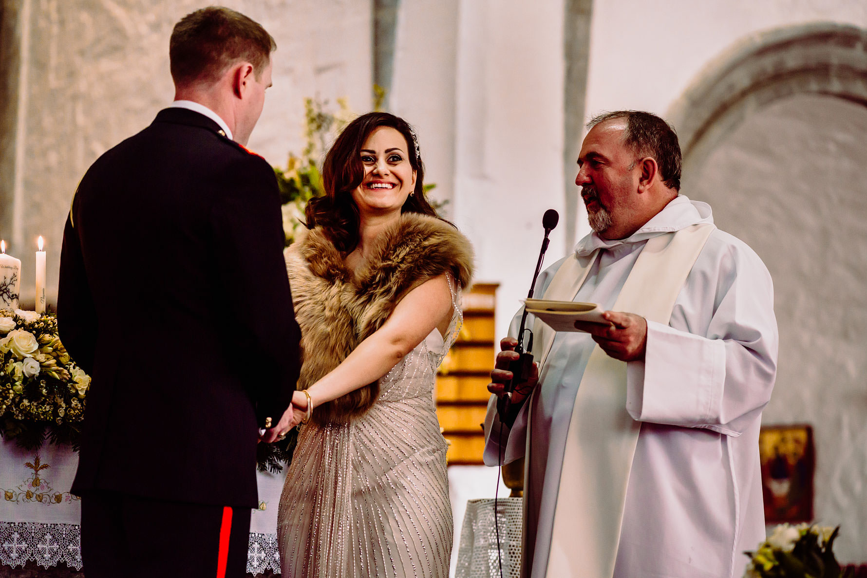 a bride smiles at her guests