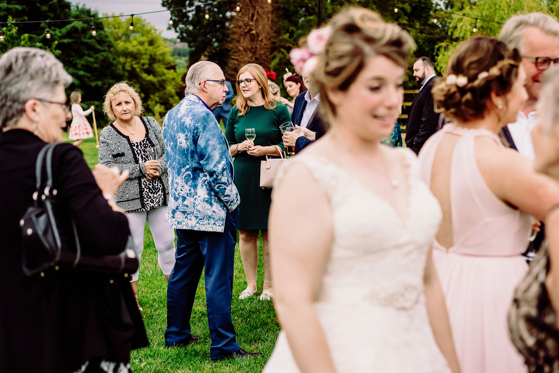 a wedding guest peeks at the wedding dress