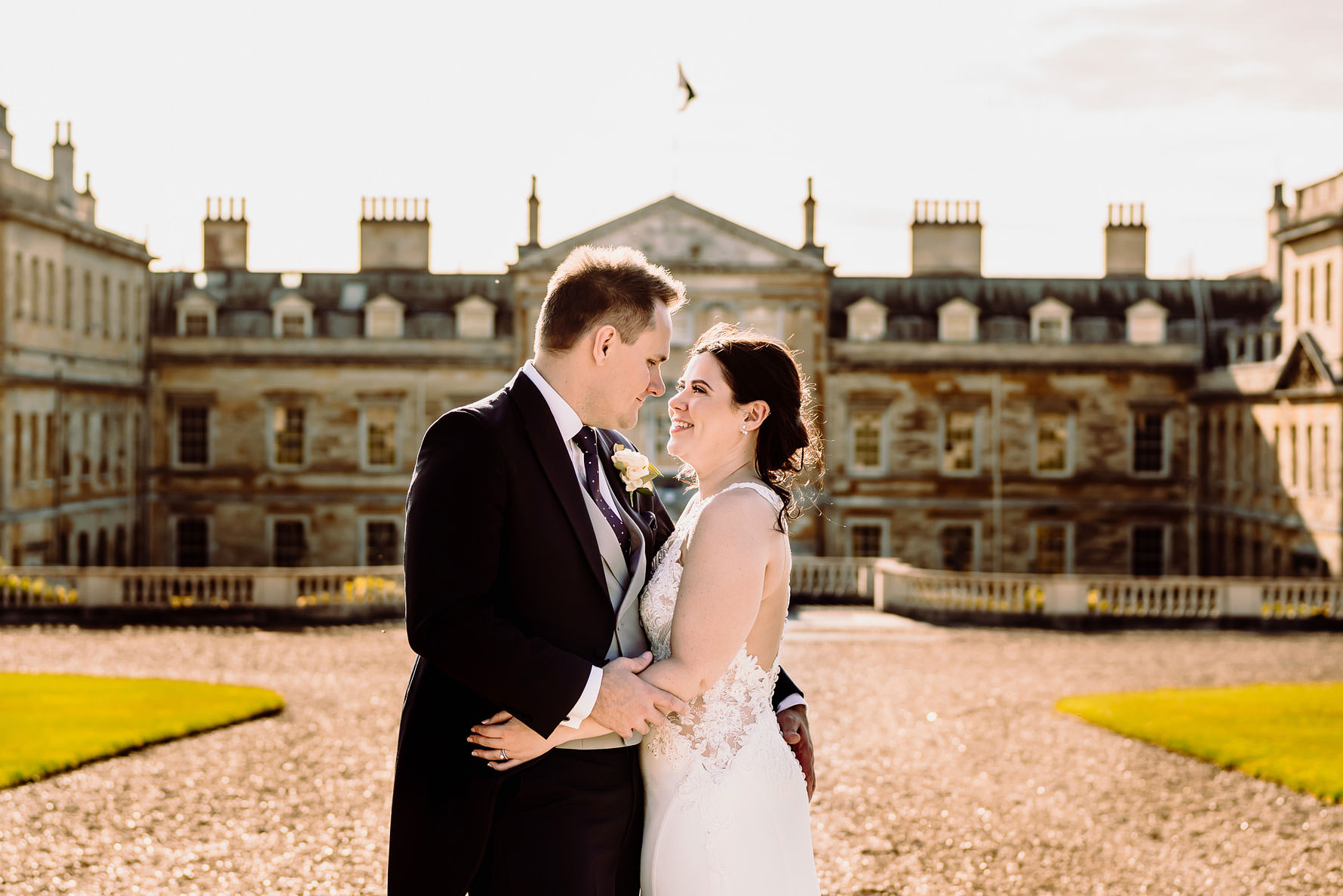 a happy bride and groom outside Woburn abbey