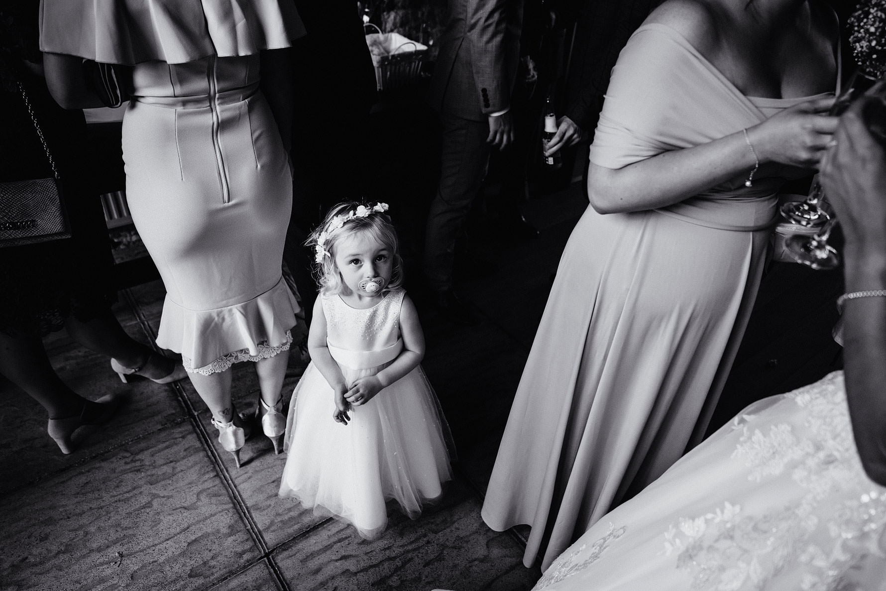 a little flower girl with a dummy