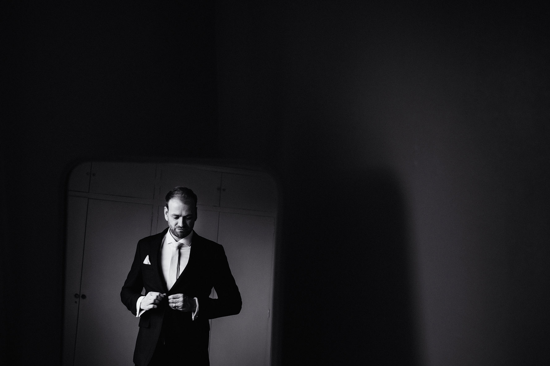 a creative portrait of a groom