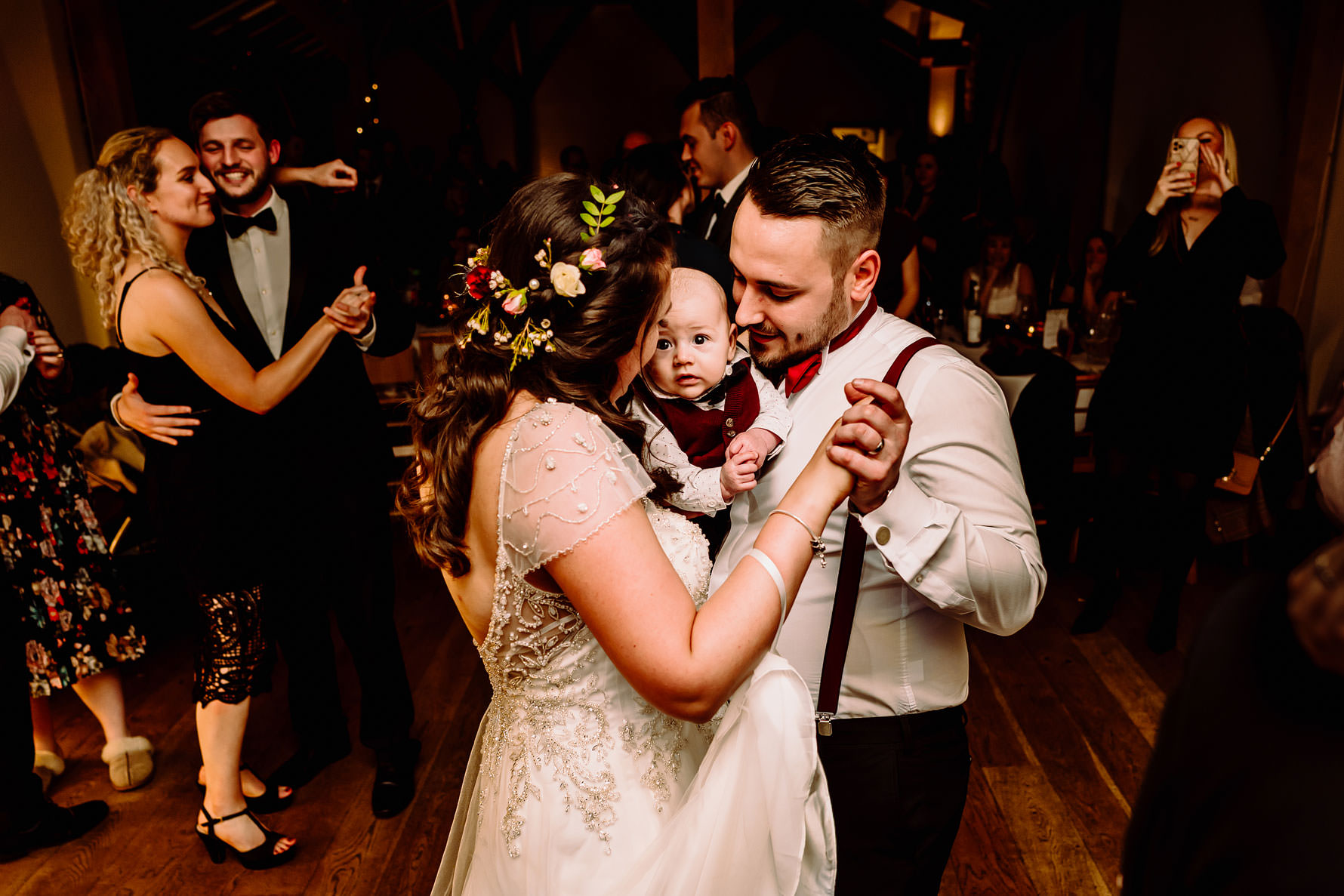 a bride and groom with their son