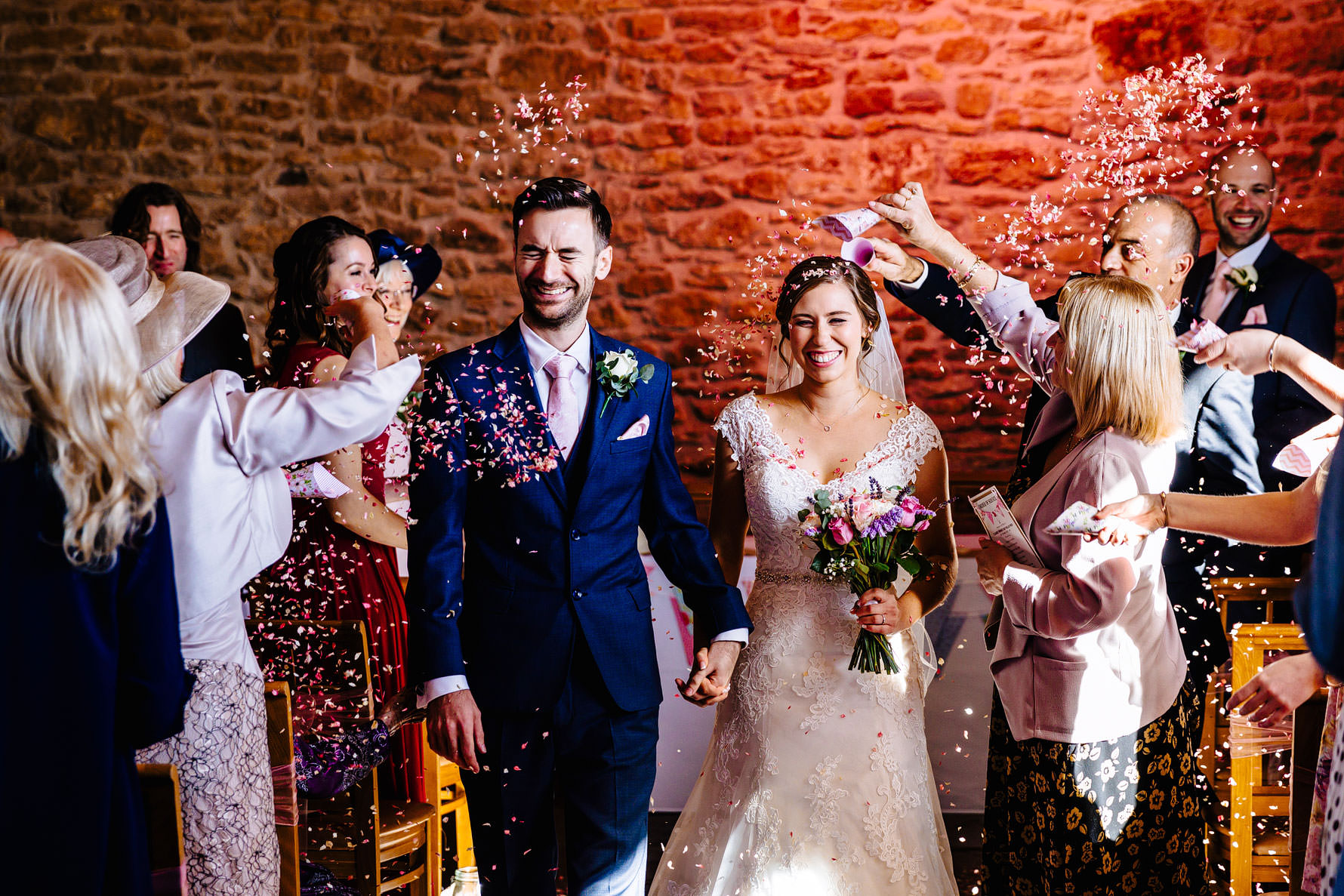 confetti throwning at a barn venue