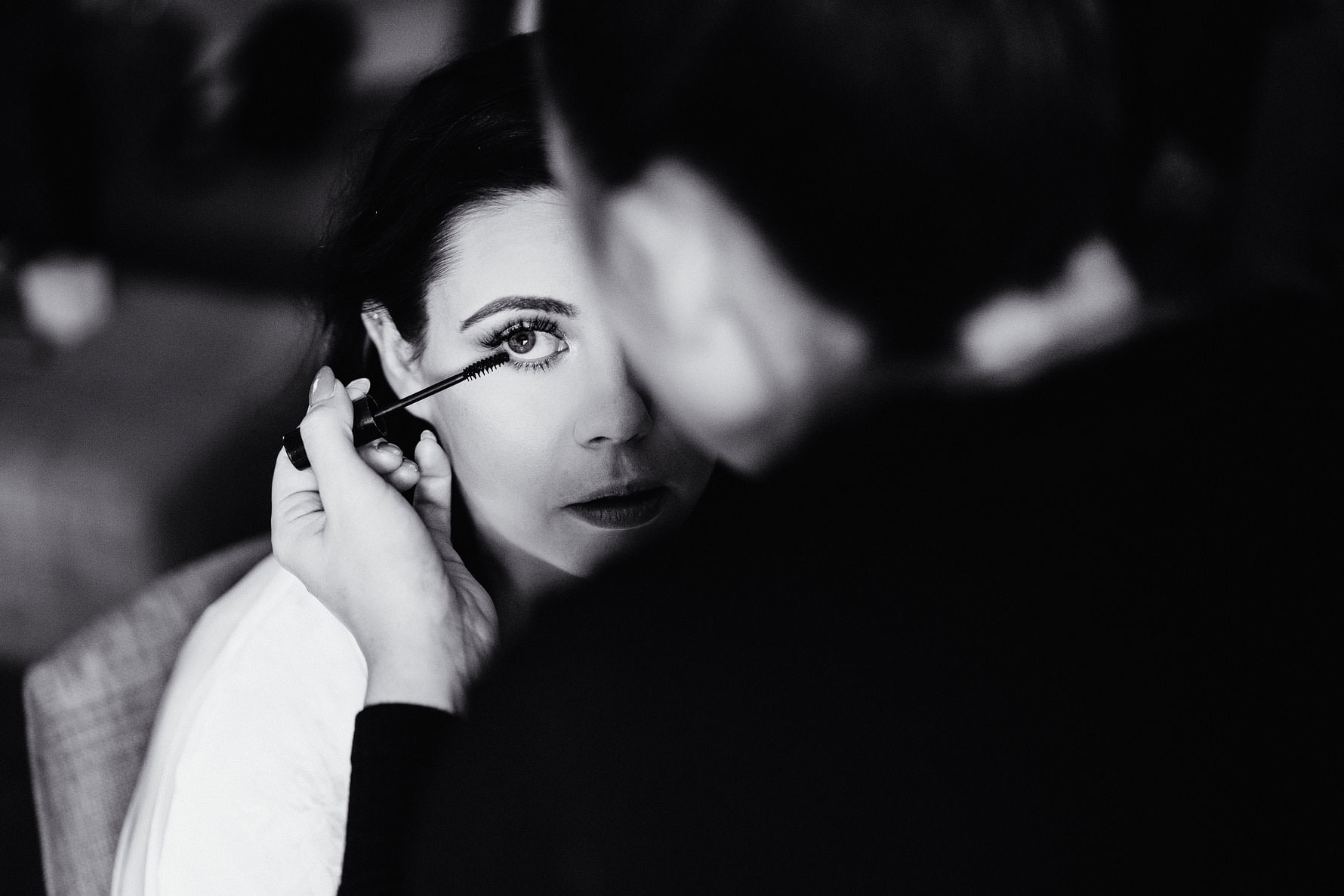 a bride has her make up applied