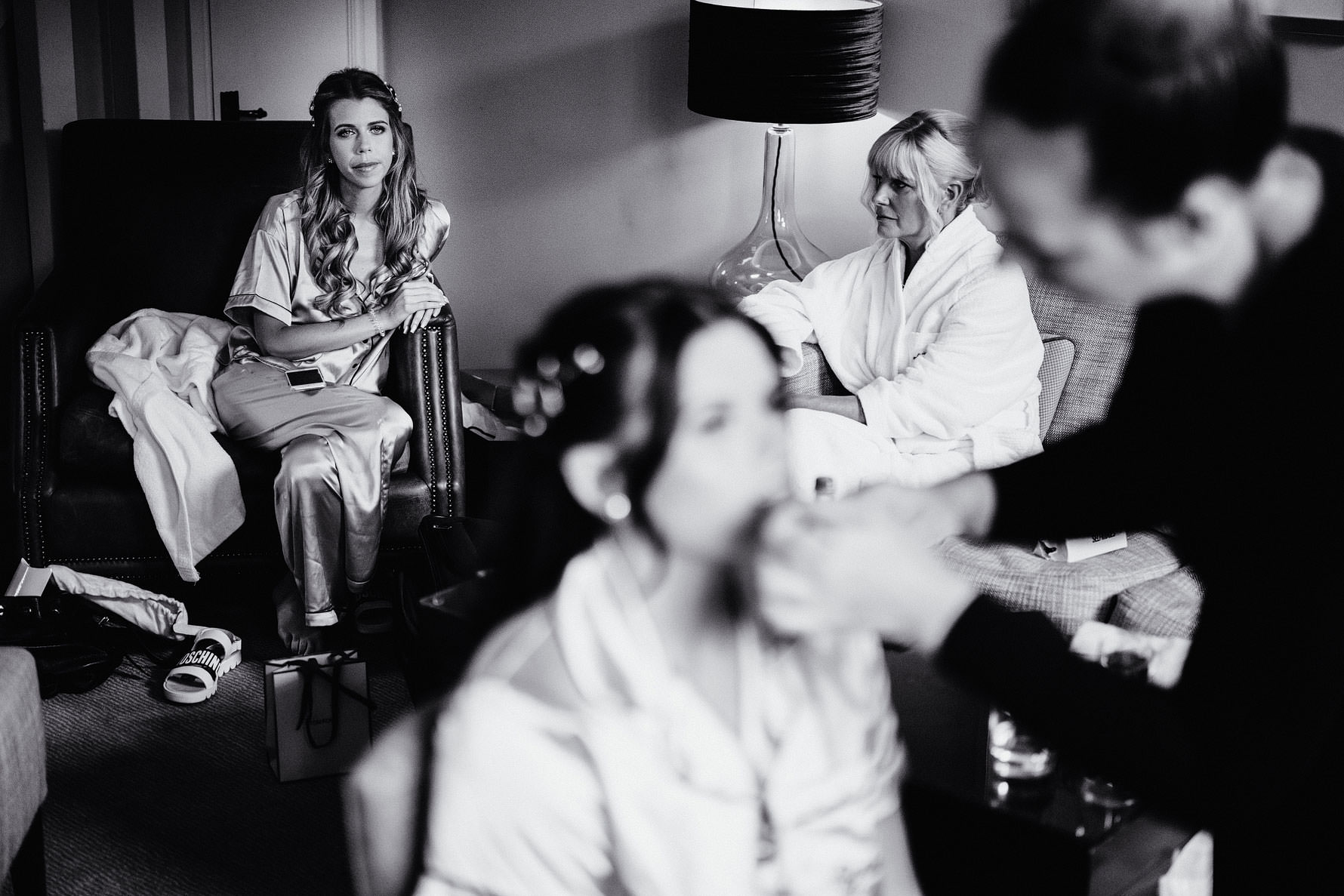 a bridesmaid watches the bride