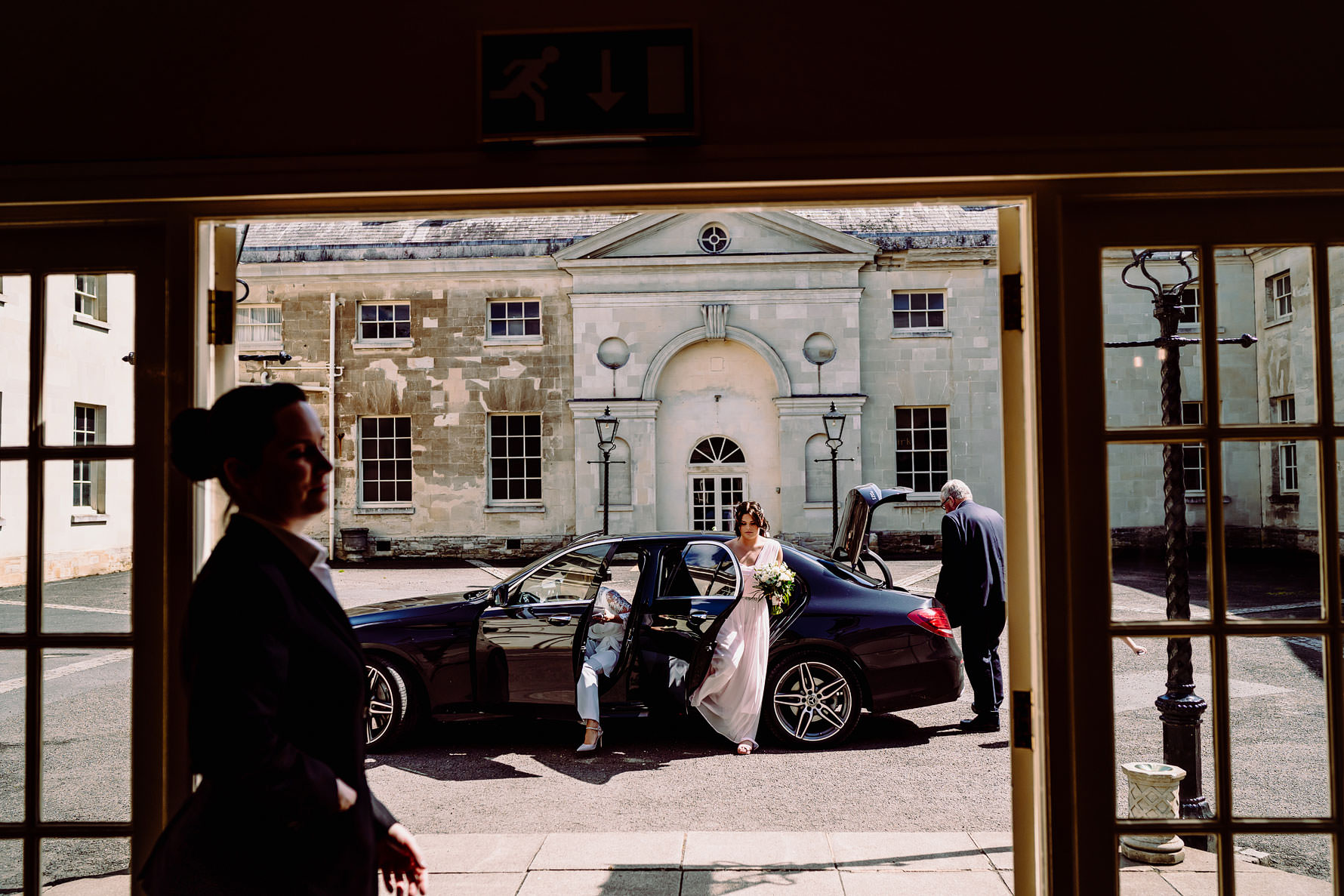 bridesmaid arriving for a wedding ceremony