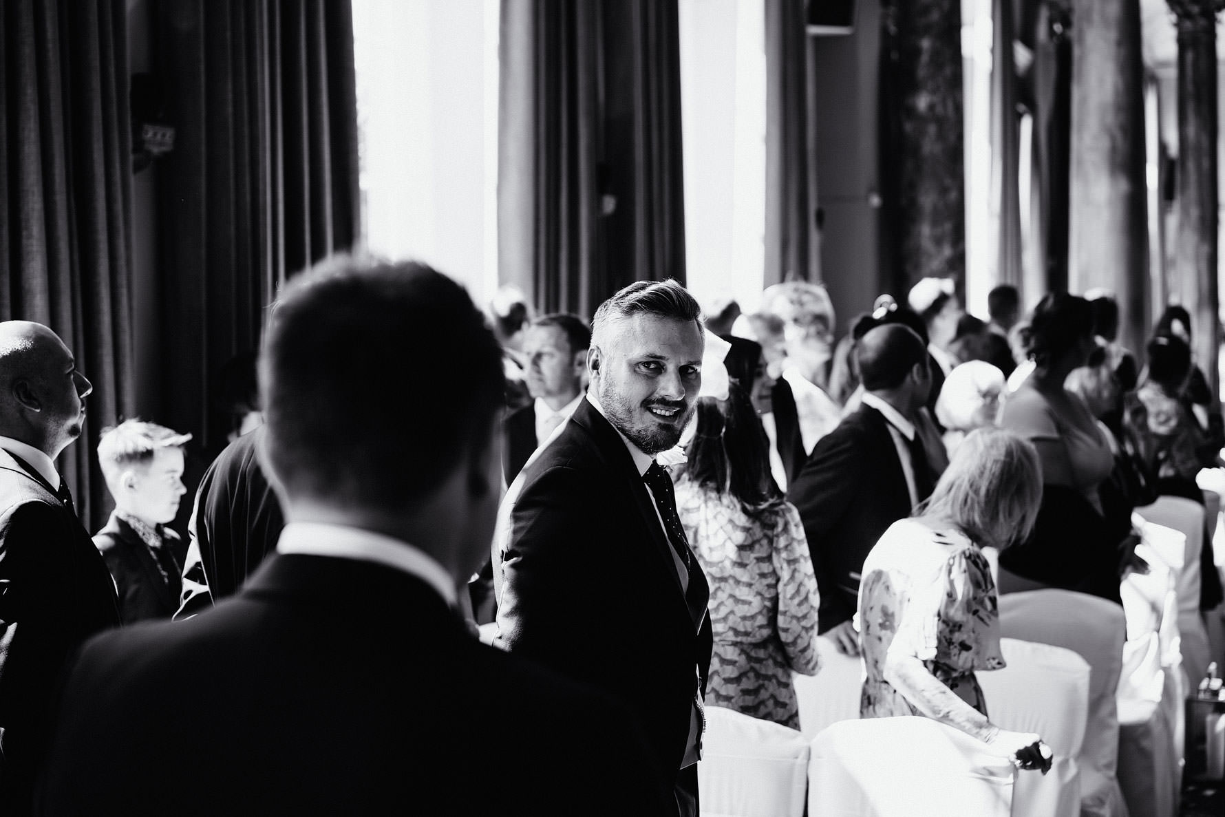 brother of the bride looks at his brother