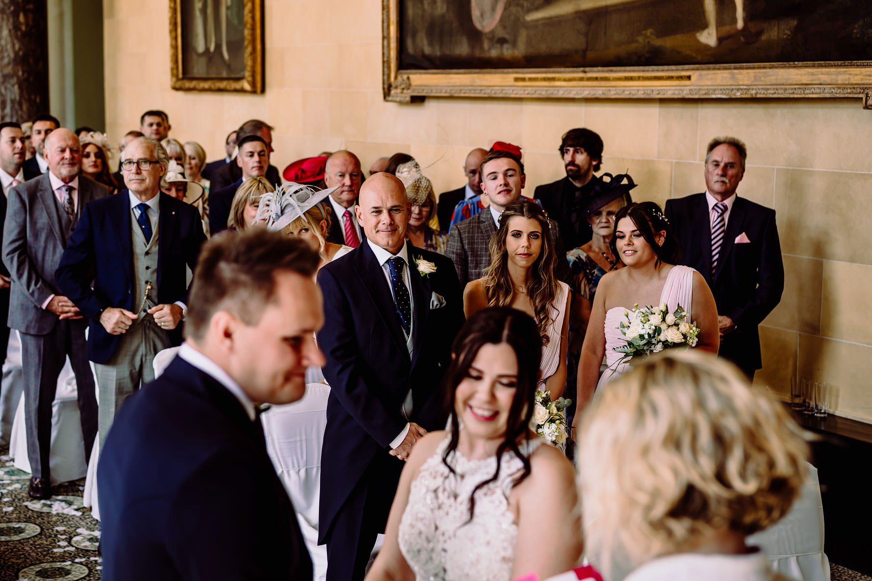 fater of the bride watches his daughter marry