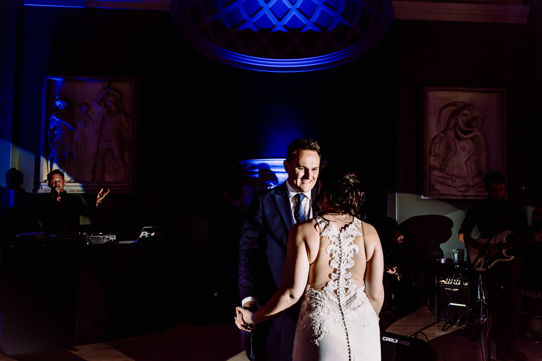 the groom smiles at his bride