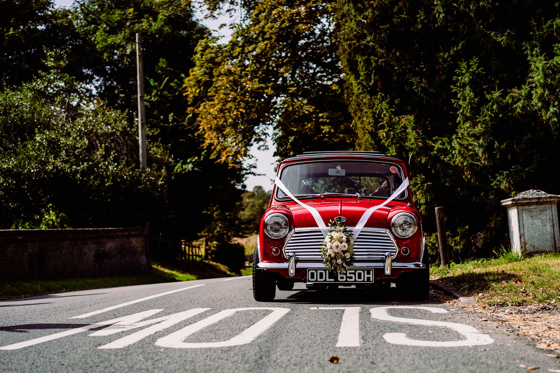 a red mini cooper at a wedding