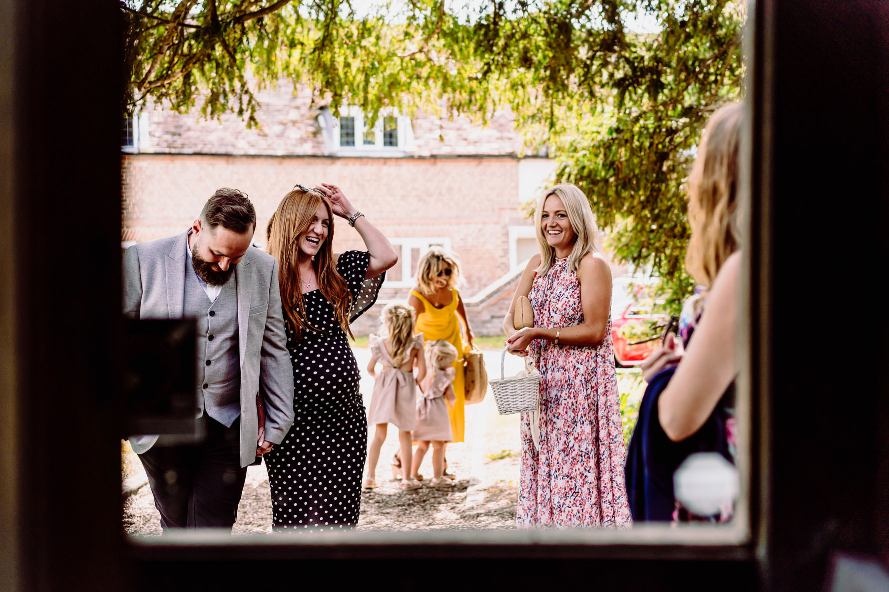 laughing wedding guests