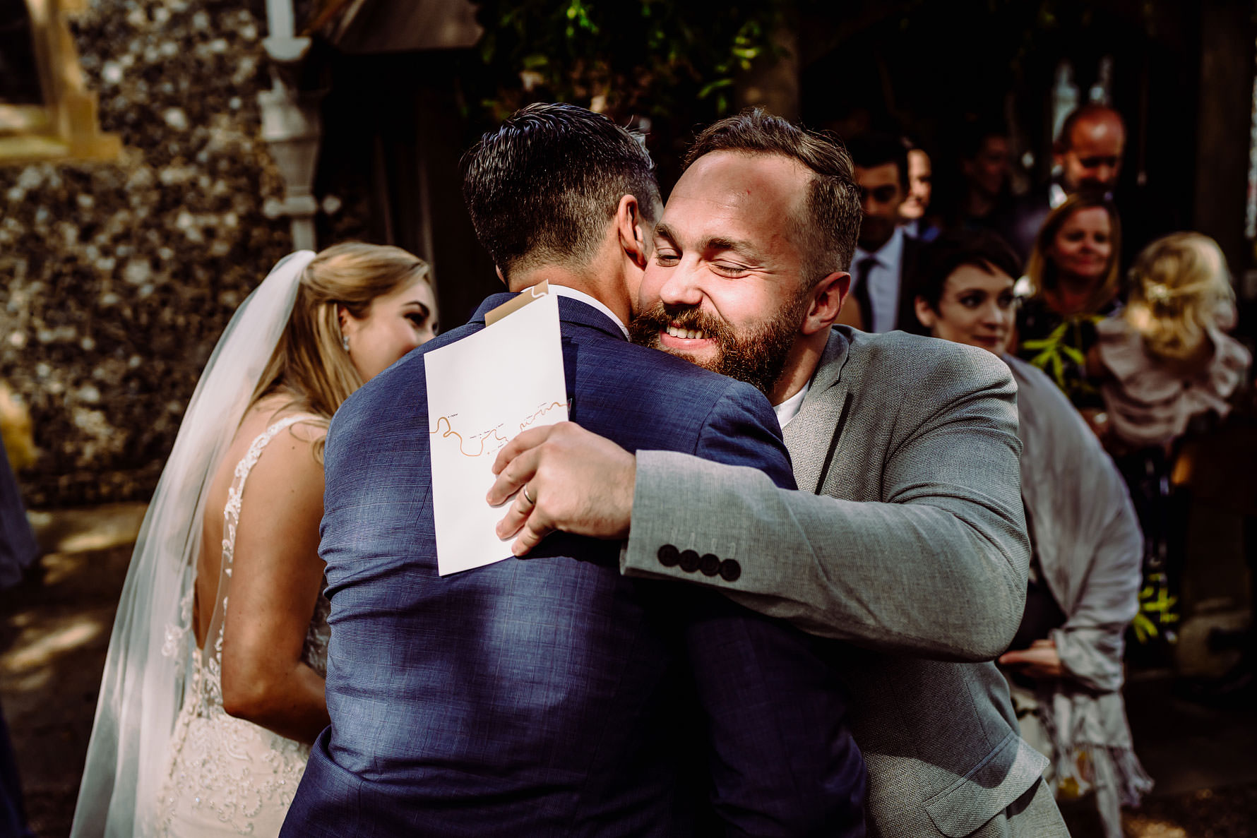 a gent congratulates the groom