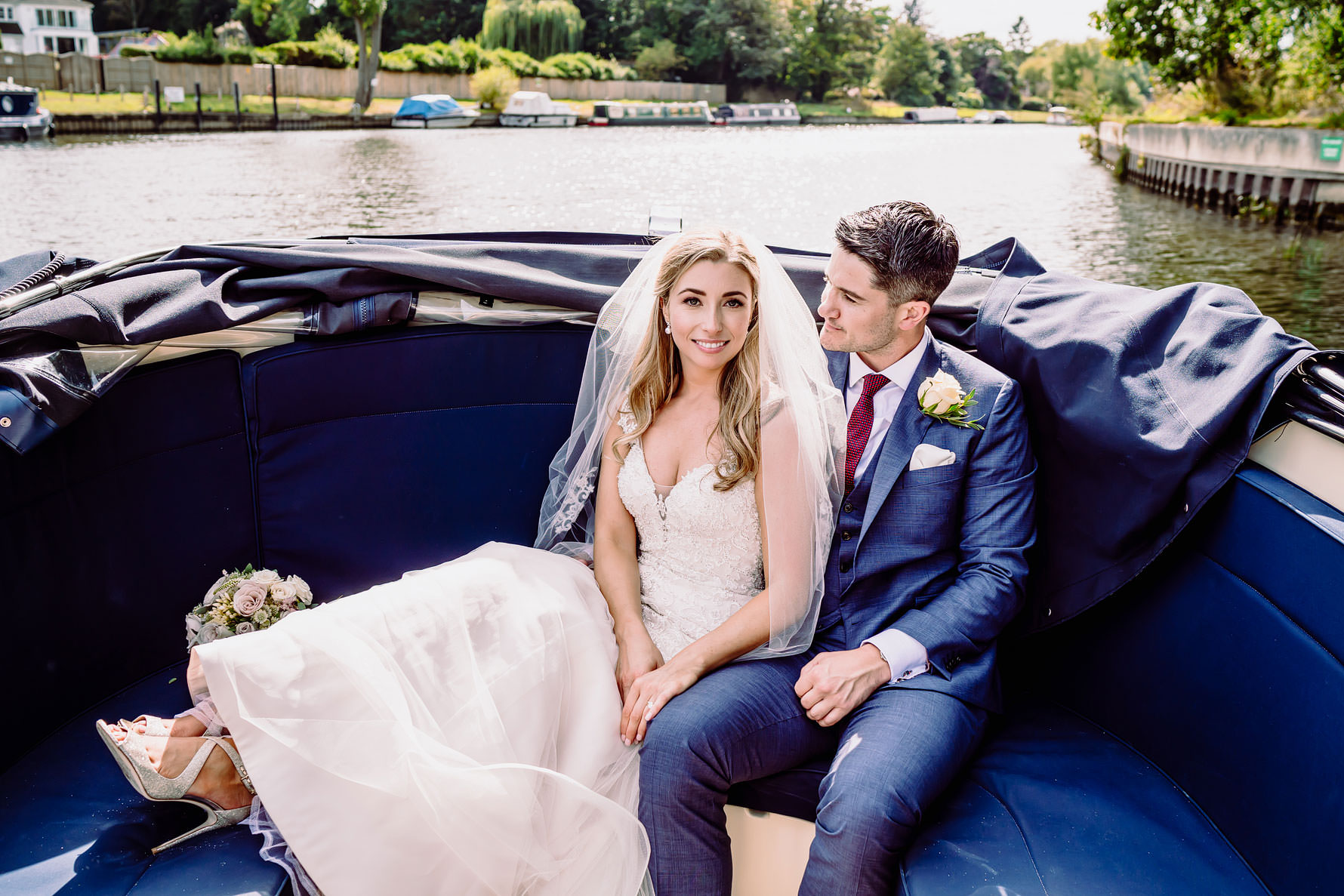 a bride and groom on a boat