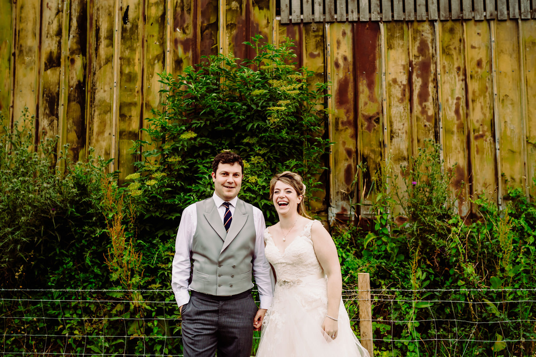 the bride and groom laughing